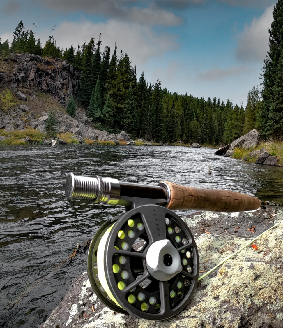 Fly rod set up with river in background