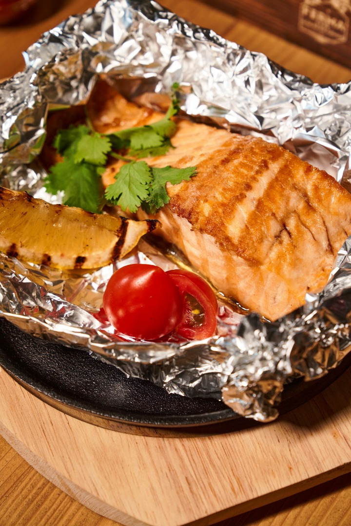 Salmon cooked in foil fully garnished