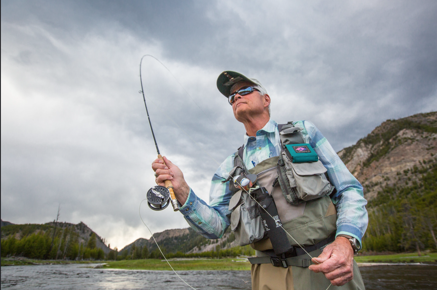 Casting fly fisherman