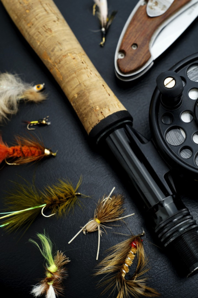 fly rod on counter with fly that are used for fly fishing